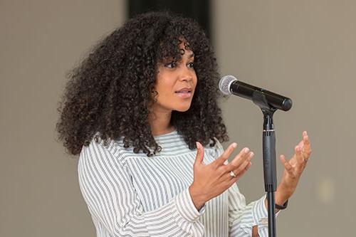 Student speaking at microphone